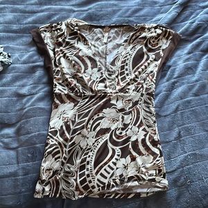 Brown and cream colors tank giving y2k vibes with the print.